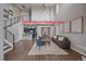 Bright living room showcasing an open floor plan, modern decor, and hardwood flooring throughout the home at 10523 Ashfield St # 5C, Highlands Ranch, CO 80126