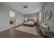 Relaxing main bedroom with wood-look flooring, neutral walls, and stylish furnishings at 10523 Ashfield St # 5C, Highlands Ranch, CO 80126