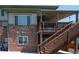 Multi-level deck of home featuring a covered area with stairs to connect levels at 24661 E Layton Pl, Aurora, CO 80016