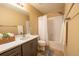 Bathroom featuring a shower-tub combination with elegant hardware and a vanity with sink and storage at 24661 E Layton Pl, Aurora, CO 80016