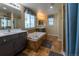 Luxurious bathroom with a soaking tub, dual vanities, and separate shower at 24661 E Layton Pl, Aurora, CO 80016