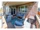 Covered deck featuring a grill, blue outdoor rug, and a sliding glass door to inside at 24661 E Layton Pl, Aurora, CO 80016