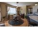Charming dining area with hardwood floors, stylish lighting, and views of the backyard at 24661 E Layton Pl, Aurora, CO 80016
