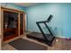 Bright exercise room with sauna and modern treadmill equipment and room for yoga or stretching on the floor mat at 24661 E Layton Pl, Aurora, CO 80016