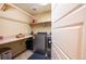 Well-organized laundry room with modern washer and dryer, ample counter space, and practical shelving at 24661 E Layton Pl, Aurora, CO 80016