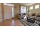 Bright and airy living room featuring hardwood floors, natural light, and comfortable seating arrangements at 24661 E Layton Pl, Aurora, CO 80016