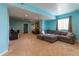 Spacious living room with large sectional couch and comfortable seating area with warm carpet flooring and recessed lighting at 24661 E Layton Pl, Aurora, CO 80016