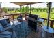 Spacious outdoor deck features furniture, grill, heater, and lovely views at 24661 E Layton Pl, Aurora, CO 80016