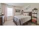 Neutral-toned bedroom with plush carpet, modern décor, and a full-sized bed with luxurious pillows at 6536 13Th St, Frederick, CO 80530