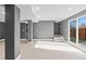 Spacious finished basement with grey walls, laminate flooring, and large window at 316 Perry St, Denver, CO 80219
