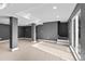 Finished basement featuring grey walls, laminate flooring, and sliding glass door at 316 Perry St, Denver, CO 80219