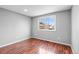 Spacious bedroom with hardwood floors and a large window at 316 Perry St, Denver, CO 80219