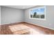 Bright bedroom with hardwood floors and large window at 316 Perry St, Denver, CO 80219