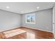 Bright bedroom with hardwood floors and a window with natural light at 316 Perry St, Denver, CO 80219