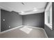 Simple bedroom with grey walls, new laminate flooring and window at 316 Perry St, Denver, CO 80219