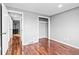 Bedroom with hardwood floors and access to the hallway at 316 Perry St, Denver, CO 80219