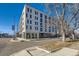 Modern brick building with street-level retail and ample parking at 603 Inca St # 213, Denver, CO 80204