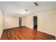 Finished basement area featuring wood-look floors and bright lighting at 6427 S Ingalls St, Littleton, CO 80123