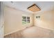 Bright, neutral bedroom with ample natural light, carpeted floors, and closet at 6427 S Ingalls St, Littleton, CO 80123