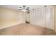 Generously sized bedroom with carpeted floors and a wall of closets for ample storage at 6427 S Ingalls St, Littleton, CO 80123