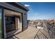 Outdoor balcony featuring wet bar with a stainless beverage cooler and comfortable lounge seating at 3600 N Pecos St, Denver, CO 80211