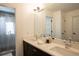 Stylish bathroom featuring dual sinks, modern fixtures, and a large mirror above the vanity at 3600 N Pecos St, Denver, CO 80211
