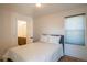 Inviting bedroom with a comfortable bed, neutral decor, and a doorway leading to an ensuite bathroom at 3600 N Pecos St, Denver, CO 80211