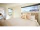 Cozy bedroom with a large window, soft lighting, and a comfortable bed with decorative pillows at 3600 N Pecos St, Denver, CO 80211