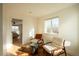 Bright seating area inside a bedroom featuring stylish chairs and an animal hide rug at 3600 N Pecos St, Denver, CO 80211