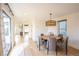 Bright dining area with contemporary lighting and a view of the entrance at 3600 N Pecos St, Denver, CO 80211