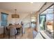 Charming dining room with patio access and a modern light fixture at 3600 N Pecos St, Denver, CO 80211
