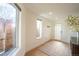 Bright entryway featuring hardwood floors, a modern front door, and large windows allowing ample natural light at 3600 N Pecos St, Denver, CO 80211
