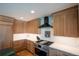 Modern kitchen boasts stainless steel appliances, custom cabinets, and stone countertops at 3600 N Pecos St, Denver, CO 80211