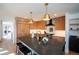 Bright kitchen features a large island with bar seating and gold pendant lighting at 3600 N Pecos St, Denver, CO 80211