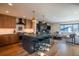 Modern kitchen with an island, stainless steel appliances, pendant lighting, and open floor plan at 3600 N Pecos St, Denver, CO 80211