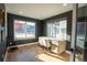 Stylish home office featuring hardwood floors, natural light, and a modern desk and chair at 3600 N Pecos St, Denver, CO 80211