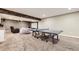 Finished basement space with ping pong table and projector screen at 6063 Eldora St, Golden, CO 80403