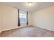 This carpeted bedroom is bright and features a window at 6063 Eldora St, Golden, CO 80403