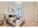 Cozy bedroom featuring plush carpet, bright window and elegant decor at 6063 Eldora St, Golden, CO 80403