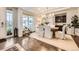Elegant dining room with hardwood floors, a stylish chandelier, and a built-in bar area at 6063 Eldora St, Golden, CO 80403
