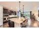 Gourmet kitchen with a large island, granite countertops, and stainless steel appliances at 6063 Eldora St, Golden, CO 80403