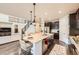 Gourmet kitchen with a large island, granite countertops, stainless steel appliances, and breakfast bar at 6063 Eldora St, Golden, CO 80403