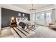 Stunning primary bedroom featuring a tray ceiling, modern lighting, and cozy furnishings at 6063 Eldora St, Golden, CO 80403