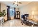 Comfortable home office with hardwood floors, a ceiling fan, and a large window at 6063 Eldora St, Golden, CO 80403