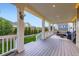 Enjoy outdoor living on this large covered patio with cozy seating area at 6063 Eldora St, Golden, CO 80403