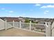 This balcony has white railings and neighborhood views at 9353 Middle Fork St, Littleton, CO 80125
