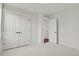 Neutral bedroom with double door closet and doorway leading to connecting room at 9353 Middle Fork St, Littleton, CO 80125
