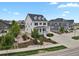 Beautiful two-story home showcasing the landscaped front yard and neighborhood at 9353 Middle Fork St, Littleton, CO 80125