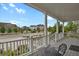 Inviting front porch with classic columns offers a relaxing outdoor space at 9353 Middle Fork St, Littleton, CO 80125