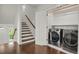 Entryway featuring a laundry room with stainless steel washer and dryer at 9353 Middle Fork St, Littleton, CO 80125
